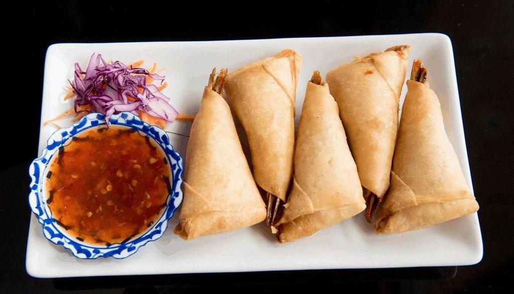 Blanket Prawns · Deep fried prawns with ground chicken wrapped in spring roll wrapper. Served with sweet chili sauce.