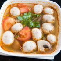 Tom Yum · Thai hot and sour soup with mushrooms, red onion, tomato, lemongrass, galangal and kaffir li...