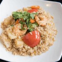 Fried Rice · Stir fried steamed jasmine rice with egg, onion, tomato, carrot, broccoli and cabbage with y...