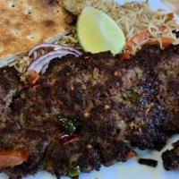 Chicken Chapit Kabob · Ground chicken patty seasoned with hot peppers, onions, tomatoes, and spices. Served with Af...