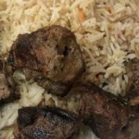 Lamb Chop · Lamb chops and well seasoned and grilled to perfection. Served with Afghan rice, salad, and ...