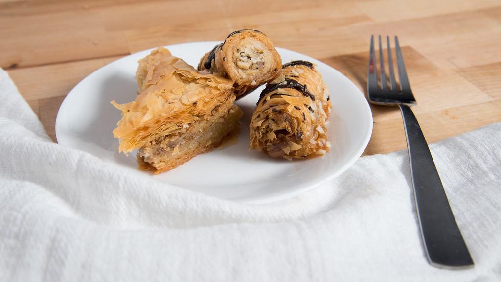 Baklava · Thin layer of syrup-soaked pastry stuffed with nuts.