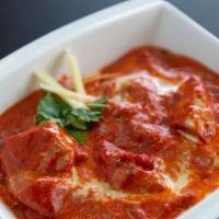 Chicken Tikka Masala · Boneless chicken marinated and cooked in the tandoor and suited with tomato based sauce.