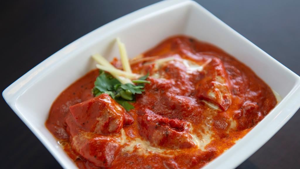 Chicken Tikka Masala · Boneless chicken marinated and cooked in the tandoor and suited with tomato based sauce.
