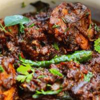Bhimavaram Chicken Pepper Fry [Dry] · Chicken cooked with onions and roasted crushed black pepper and spices.