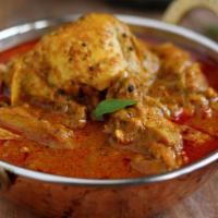 Chicken Curry · Boneless chicken prepared in mildly spiced sauce.