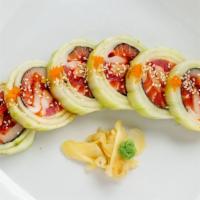 Naruto Roll · White fish, tuna, salmon, crab and avocado with thin sliced cucumber and special ponzu sauce.