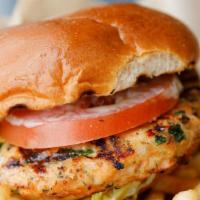 Salmon Burger · 1/2 lb patty, with crazy sauce, lettuce, tomato, on a fresh brioche bun. Served with French ...