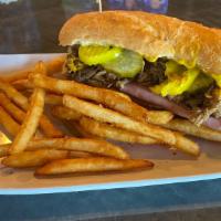 Cuban · Pulled pork, sliced ham, Swiss cheese, pickles, pepperoncinis, and cajun mustard served on F...