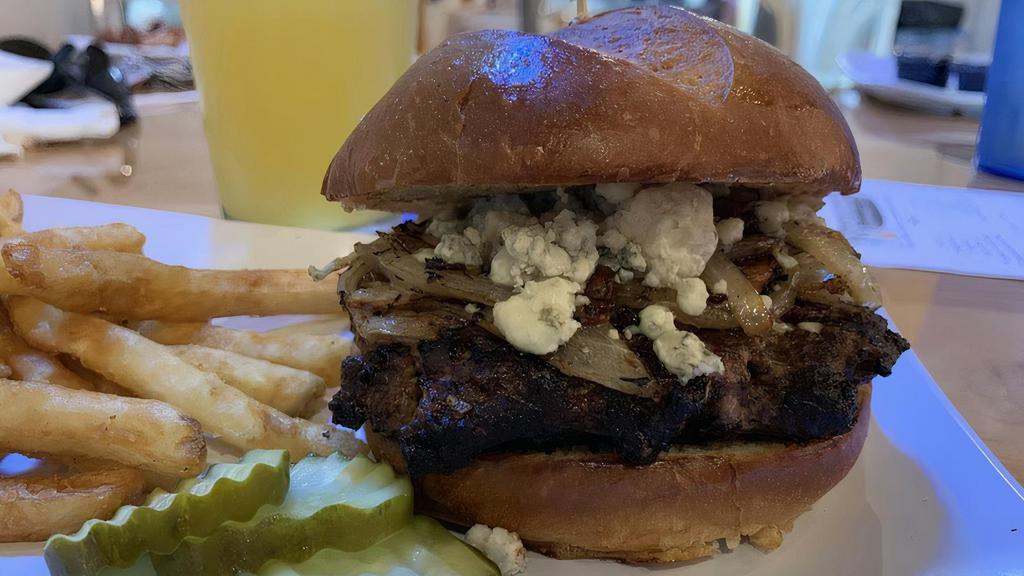 Black & Bleu Burger · Sautéed thyme mushrooms and onions, topped with blackened seasoning and bleu cheese crumbles. Served on an artisan bun.