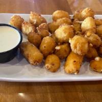 Cheese Curds · Real Wisconsin white cheddar lightly battered, fried to perfection, and served with your cho...