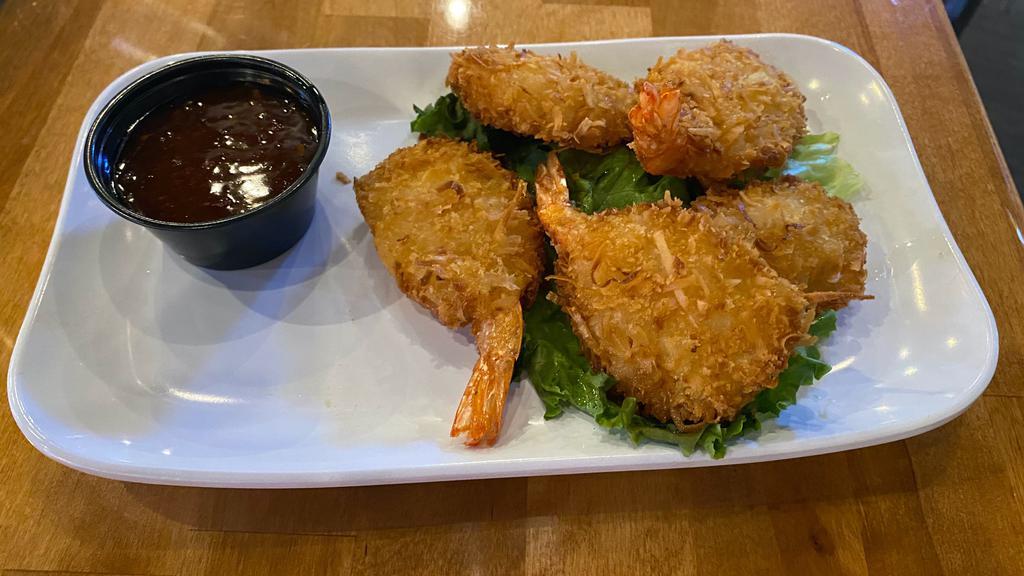 Coconut Shrimp · Coconut butterfly shrimp served with a sweet chili dipping sauce.