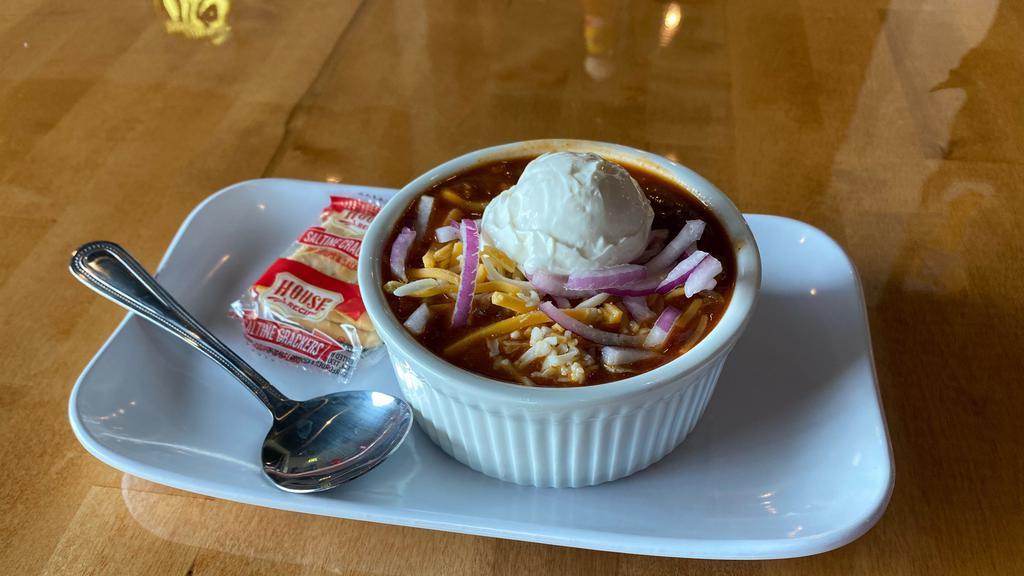 House Made Chili · Our house-made chili topped with shredded cheese and sour cream.