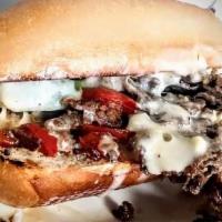Sandwiches-Truckin' Philly · Grilledsteak OR chicken, topped with sautéed onions and bell peppers, provolone, and queso o...