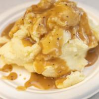 Mashed Potatoes · Creamy mashed potatoes, covered in tasty gravy!  Delicious!