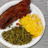 Bbq Pork Ribs · Delicious BBQ pork ribs, available in full and half slabs. Make sure to tie a napkin around ...
