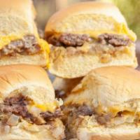Castle Sliders · Our signature burgers, served with onions, pickles and American cheese on Martin's potato ro...