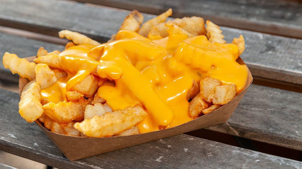 Cheese Fries · Crinkle cut fries served with Cheddar cheese sauce.