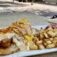 Country Style Benny · Fried chicken, biscuits, sausage gravy, topped with hot sauce and served with a side of camp...