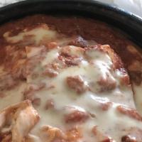 Lasagna · Seasoned beef and ricotta cheese and layered between pasta. Topped with bolognese sauce and ...