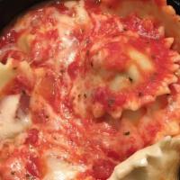 Baked Ravioli · Sun shaped ravioli stuffed with your choice of ricotta cheese or top sirloin, topped with ei...