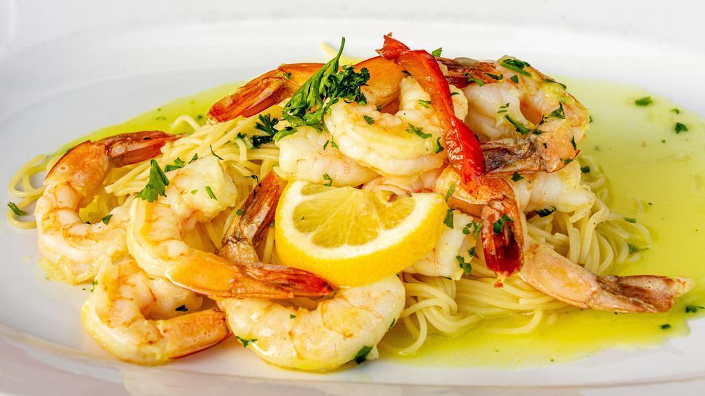 Shrimp Scampi · Colossal shrimp sautéed and seasoned in a garlic lemon sauce on top of a bed of angel hair pasta. Served with choice of side and garlic bread.