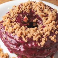 Blueberry Coffee Cake · Blueberry + vanilla bean cake donut, fresh blueberry jam glaze + topped with coffee cake cru...