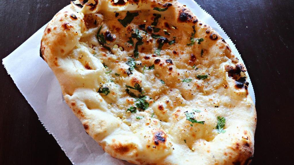 Garlic Naan · Topped with garlic and butter.