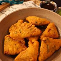 Cheese Pakoda · India's version of mozzarella sticks. Seasoned chickpea batter-fried fritters made with pane...