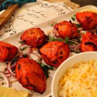 Chicken Tikka Kebab · Tender chicken breast marinated in a spiced herb yogurt. Served with basmati rice.