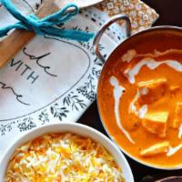 Paneer Tikka Masala · Delicate cubes of paneer cheese simmered in a sweet, yet spiced tomato-cream sauce. Served w...