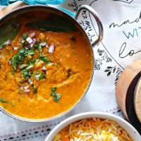 Dal Fry · Yellow lentils simmered in a cumin-spiced blend of onion, garlic, and tomato. Served with ba...