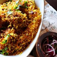 Chicken Biryani · A medley of aromatic basmati rice, layered with herbs & roasted spices and slow cooked until...