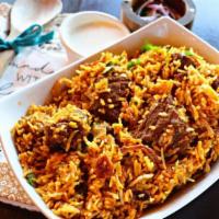 Lamb Biryani · A medley of aromatic basmati rice, layered with herbs & roasted spices and slow cooked until...