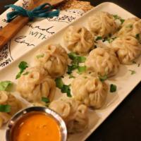 Chicken Momo Dumplings · Dough-rolled dumplings filled with a savory Nepali stuffing and steamed to melt-in-your mout...