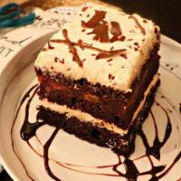 Black Forest Cake · Scrumptious chocolate cake between layers of whipped cream and sweet n'tart red cherries. Th...