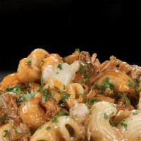 Monster Mac & Cheese · Our homemade four-cheese Monster Mac, baked with love and tenderness. Top with chicken, baco...