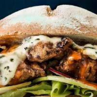 Buffalo Chicken Burger · New. Our delicious spicy buffalo chicken patty with a black-and-blue melted cheese on a warm...