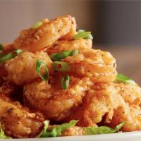Voodoo Shrimp · Lightly battered shrimp tossed in our homemade sweet and savory Voodoo sauce.
