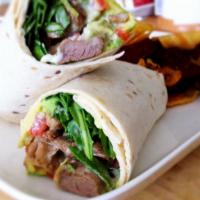 Lamb Kebab Wrap Sandwich · Our charcoal-grilled ground lamb patties topped with lettuce, cucumbers, and our juicy diced...
