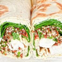 Taboulli Roll Basic · We smother our wrap with hummus, Baba ghanoush, crumbled feta, lettuce, diced tomatoes, cucu...