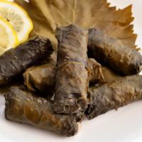Grape Leaves Plate · Enjoy six of our mouth-watering dolmas stuffed with deliciously seasoned rice, served with o...