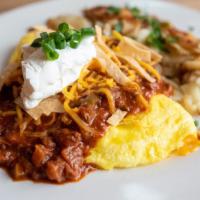 Chili Omelet · smoked brisket chili / Cheddar / green onion / sour cream / tortilla / home fries