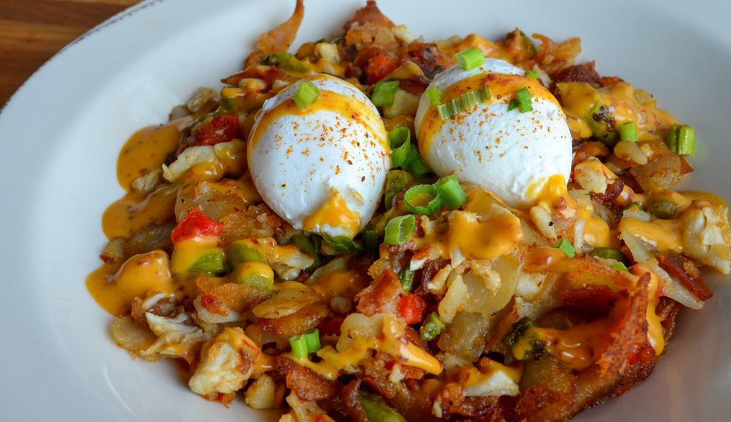 Crab Hash · lump crabmeat / home fries / bacon / fried eggs / asparagus / roasted red pepper / chipotle hollandaise / Old Bay