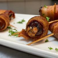 Bacon Wrapped Dates · Thick center-cut bacon, four-month manchego wrapped dates.