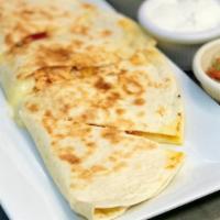 Ropa Vieja Quesadilla · Cuban braised beef, onions, bell peppers, tomato, mozzarella cheese, chimichurri, and pico D...