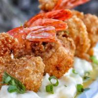 Quinoa Crusted Shrimp · Crunchy shrimp, honey ginger glaze, mashed potatoes, and spring onions.