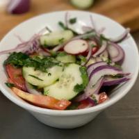 Fresco Salad · Microgreens, radish, onions, tomato, cucumber, and lemon vinaigrette.