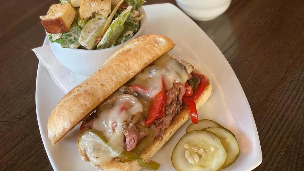 Gf Philly Dip · slow-roasted choice Angus ribeye, sautéed peppers, onions and mushrooms, fontina cheese, gluten free bun and au jus.