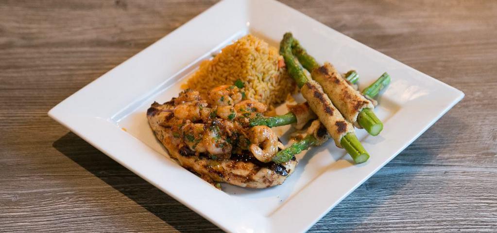 Grilled Chicken · shrimp, sweet toasty garlic, chipotle peppers, cajun spices, red rice, sautéed vegetables